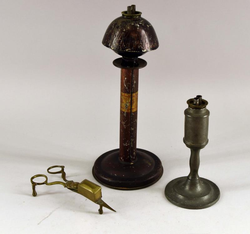 Primitive Whale Oil Lamps: Consisting Of A Pewter Candlestick Whale Oil Lamp And A Tin Marked Tindeco Whale Oil Lamp. Together With A Brass Wick Trimmer. Tindeco 9.5" Tall, All The Pieces Are In Used Condition.