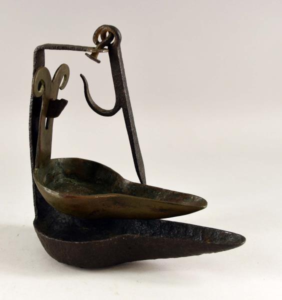 Hand Forged Betty Or Phoebe Lamp Light: Featuring The Double Hand Forged Lamp Of A Phoebe Or Betty Lamp. The Top Was Used With The Oil And Wick, The Bottom Was Used To Catch Any Oil That Might Drip To Be Used Later. The Lamp Measures 7.5" T