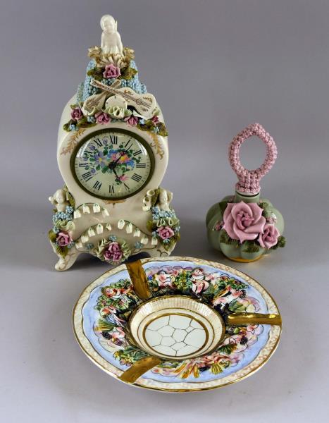 Capodimonte Reina Califa Applied Floral Clock: Featuring A Capodimonte Reina Califa Applied Floral Clock. Together With A Reina Califa Floral Perfume Bottle And A Capodimonte Ashtray. The Clock Has Several Missing Ribbon Decorations On The Top, Th