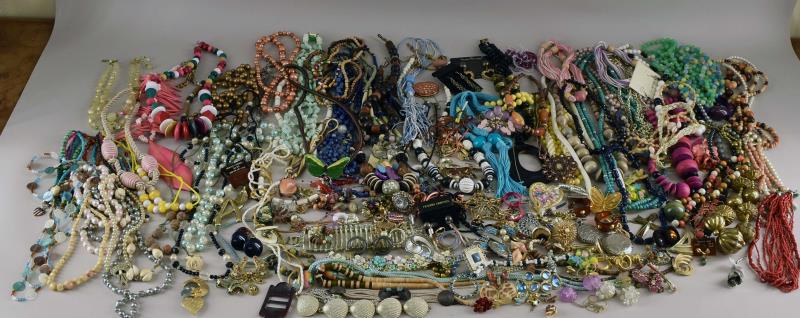 A Huge Group Of Costume Jewelry: Consisting Of Dozens Of Necklace, Earrings, Bracelets And Pins. Various Named Pieces, Plastic Beaded Necklaces, Mother Of Pearl, Cloth Necklaces, Mid-century Bracelets, And More.