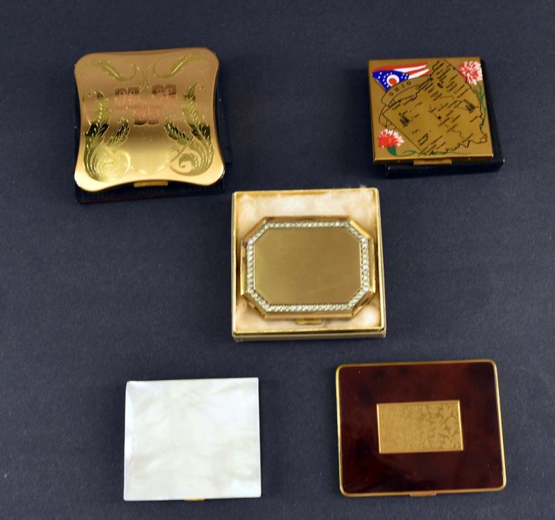 A Group Of Five Vintage Compacts: Consisting Of Two Elgin, An Avon, A German And An Unmarked Mother Of Pearl. All In Good Condition, The Two Elgin Have The Original Soft Cases, The Avon Is In The Original Box. All In Good Condition.