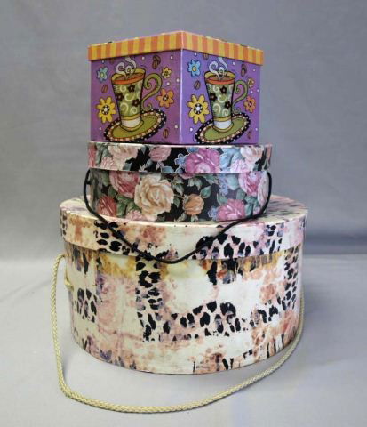 Collection of Decorative Boxes: Large hat box, with several groups of graduating size boxes.
