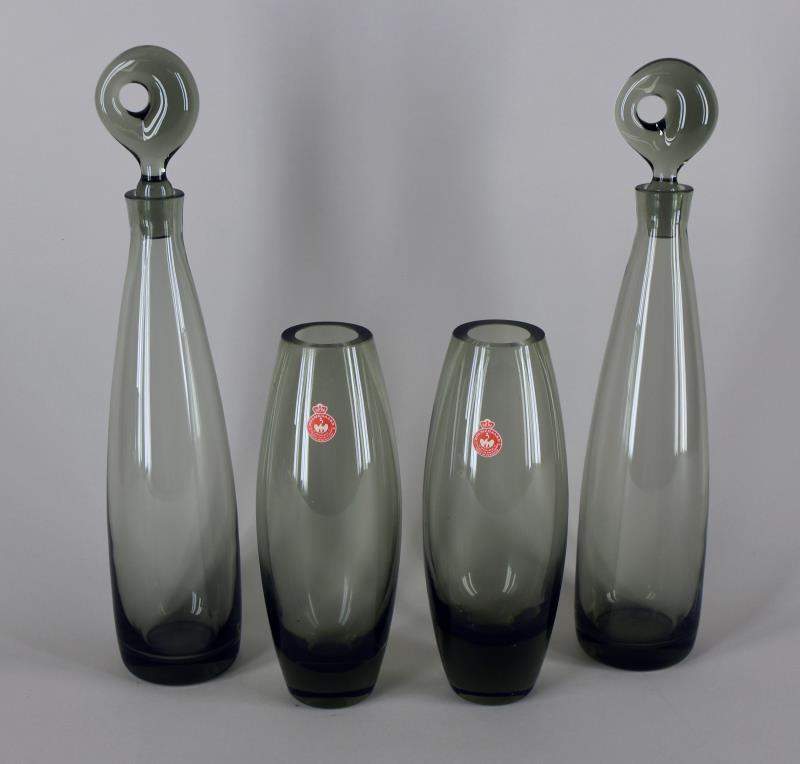 Holmegaard Mid Century Vases And Decanters: Featuring A Pair Of Holmegaard Smoke Glass Vases, Measuring 9" Tall And 3.5" Wide. Both Are In Excellent Condition, With The Original Paper Tag. Together With A Pair Of Unmarked Smoked Glass Decanters
