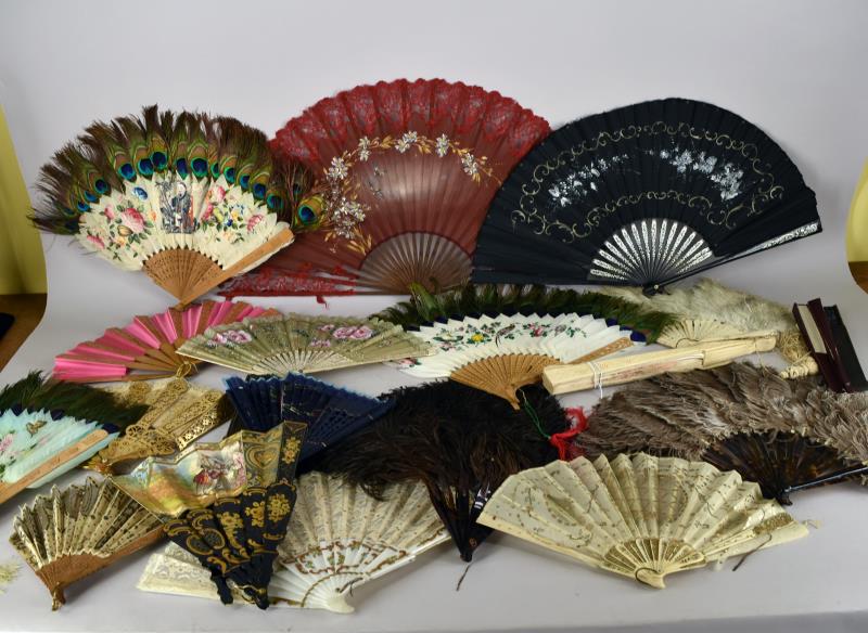 Group Of Antique Fans: Including Ostrich Feather, Peacock Feather, Lace, Wood Carved, Hand Painted And More. Over 20 Various Fans From Late 1800's To The Mid 1900's, Most Are In Good Condition. The Carved Bone Has A Broken