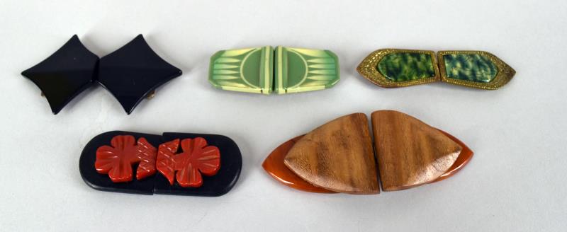 Bakelite And Celluloid Ribbon Or Belt Buckles: Consiting Of Three Bakelite Ribbon Buckles, Black, Wood With Bakelite Accents And Red With Black Background. Together With A German Celluloid Buckle And A Green And Gold Gilt Czechsolvakia Ribbon Buck