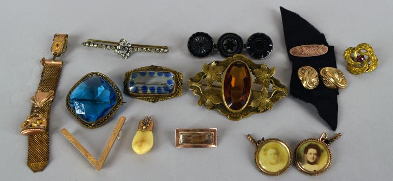 Victorian Gold Filled Pins And Watch Fobs: Consisting Of Three Pins Or Brooches With Glass Center Stones, Unmarked, Largest 2.5" X 1.5". A Pair Of Portrait Cuff Links, One Faded, Unmarked, A Braided Hair Pin, A 10k Moose Tooth, A Pair Of Sewn 