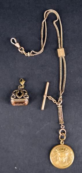 Victorian Gold Filled Watch Fobs: Consisting Of An Intaglio Fob And An Indian Fob On A Slide Chain. The Indian Chain With Fob Measures 14". The Slide On The Chain Does Work But One Of The Chains Are Twisted And Does Not Slide All The 