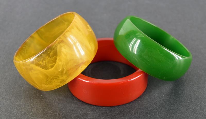 Three Bakelite Bangle Bracelets: Featuring A Red, Green And Mottled Juice. The Bracelets Are Various Widths Between 1" To 1.5" Wide, 2.5" Across The Center. All Are In Very Nice Condition, No Chips Or Cracks.