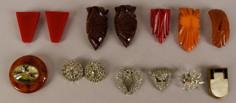 Bakelite And Rhinestone Dress Clips: Consisting Of Two Sets Of Bakelite Dress Clips And Four Unmatched Bakelite Dress Clip. Including A Flying Duck Sulphide Dress Clip. The Bakelite Dress Clips Measure Approximately 2" Long And 1" Wide, 