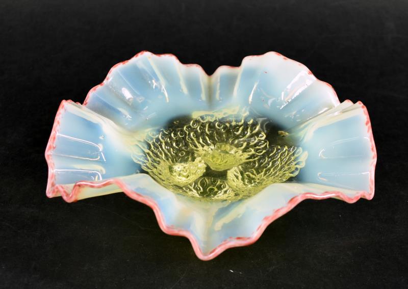 Vaseline Opalescent With Cranberry Edge Bowl: Featuring A Four Footed Ruffled Edge Vaseline Opalescent Bowl With A Cranberry Edge. The Bowl Has A Peacock Feather Design Around The Four Feet, With A Crimped Ruffled Edge. Measuring 2.5" Tall An 8"