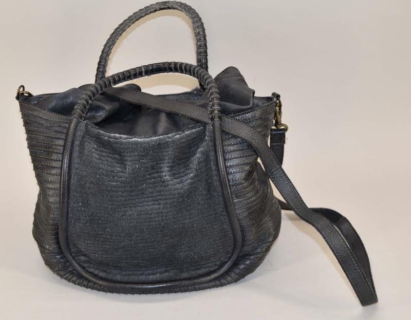 Majo Calf Skin Leather Tote: Featuring A Large Majo Calf Skin Leather Tote Measuring 14" Across, 20" Tall, 9.5" Deep Along The Bottom Tapering Up To 10" Across The Top, 7" Drop Handle, 25" Shoulder Strap Drop On One Side. The Top