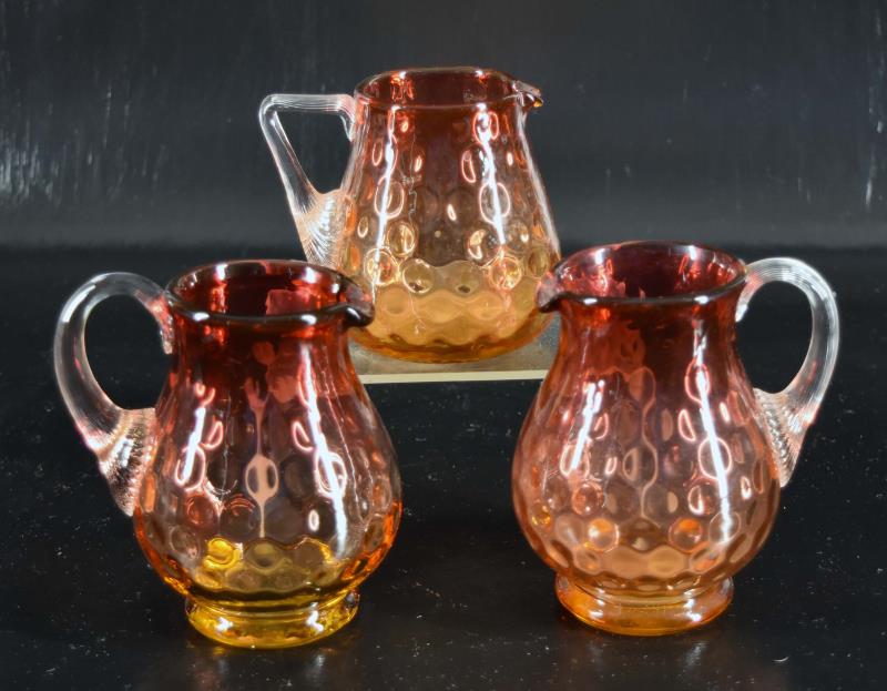Three Small Amberina Reverse Thumbprint Pitchers (1 of 3)