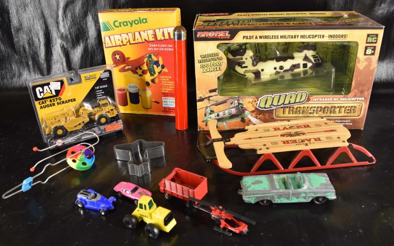 Group Of Toys: Featuring The Quad Helicopter, Crayola Airplane Kit And Cat Auger, All In Original Package Never Opened. Together With A Tootsie Car And Several Used Toys.