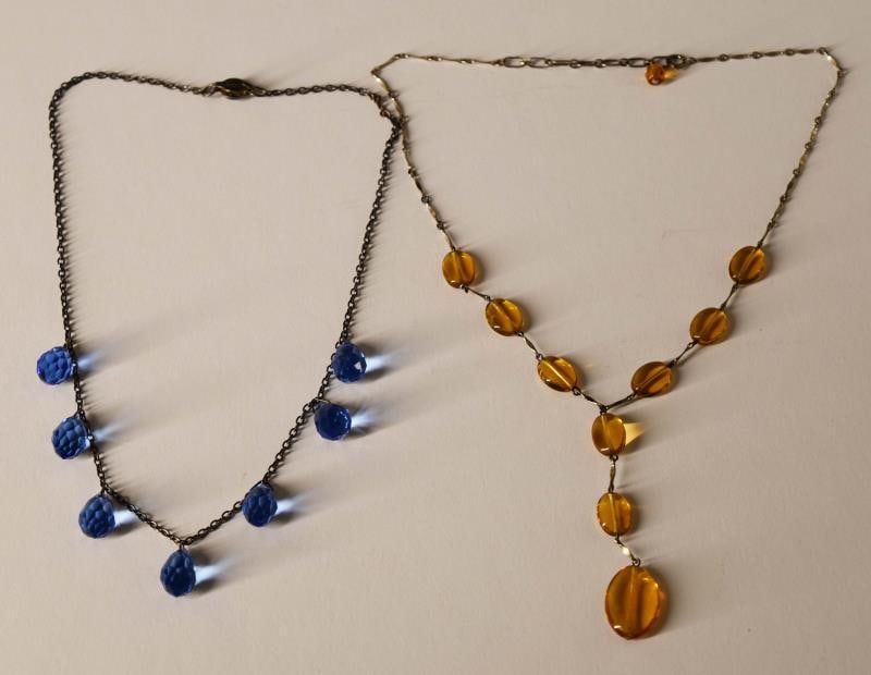 Victorian Blue & Amber Necklaces: Featuring A Blue Faceted Teardrop Victorian Necklace Measuring 16" Long. Together With An Amber Glass Bead Necklace Measuring 15" With The Center Drop Of 3". Both Are In Good Condition, No Hallmarks.