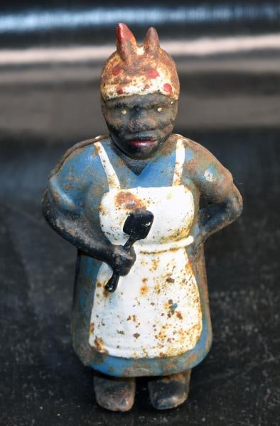 Black Americana Mammy Cast Iron Still Bank: Featuring Mammy Still Bank, Measuring 5.75" Tall, Extensive Paint Wear And Rust.
