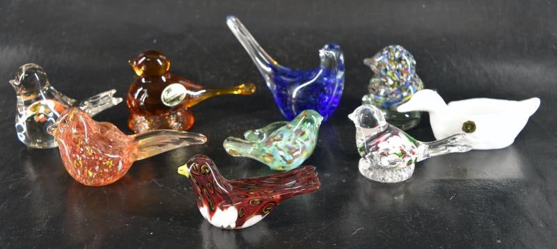 Nine Art Glass Bird Paperweights Or Figurines: Featuring A Westmoreland Duck, Kanawha Amber Glass Bird On A Nest And Seven Others Unmarked And In The Style Of Murano. The Birds Measure Between 2" To 3.5" Tall And 3" To 5" Beak To Tail. All Are In