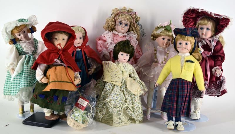 Group Of Eight Porcelain Dolls: Featuring Ashton Drake Or Paradise Dolls Including A Hummel Little Red Riding Hood, Paradise Red Riding Hood Doll A Ballerina And Others. Measuring Approximately 17" Tall. Condition Is Good On All Ite
