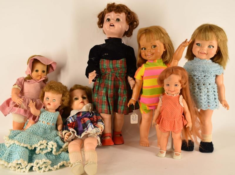 Group Of Seven Vintage Dolls: Featuring Six 1970's Ideal Dolls And A Hard Plastic Doll All Measuring From 12" To 22" Tall.