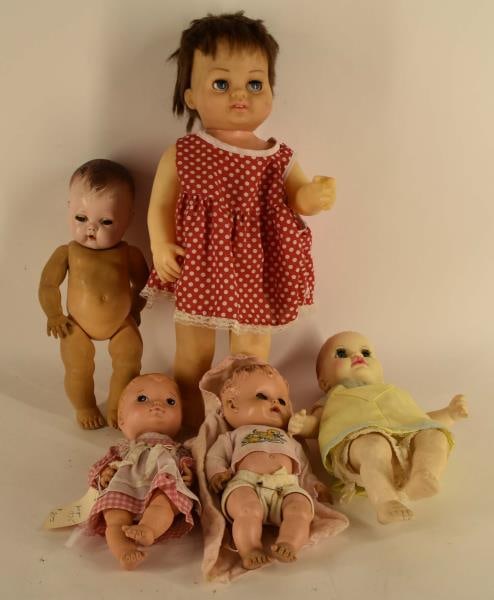 Group Of Five Baby Dolls: Featuring Five Baby Dolls Including A Character Doll, A 1971 Ideal Doll, A Sunbabe So-wee Doll, A Vogue 1975 Doll, And A 1960 Chatty Cathy. Dolls Are All In Original Clothing And Measure From 9 1/2" T