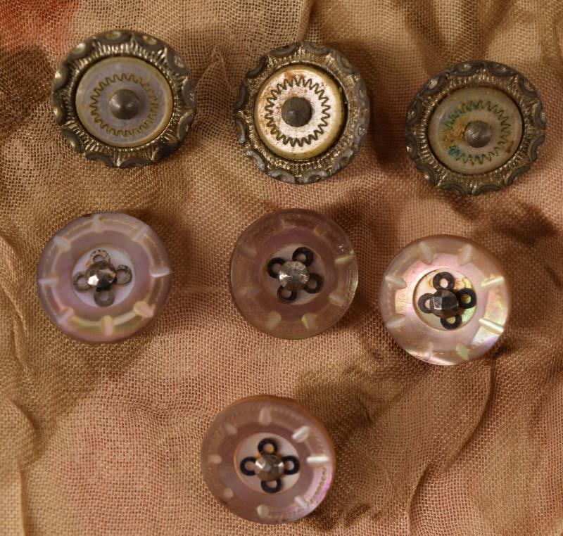 Seven Mother Of Pearl & Cut Steel Buttons: Featuring A Set Of Three And A Set Of Four Mother Of Pearl And Cut Steel Buttons, Measuring Approximately 1/2", National Button Society Small.