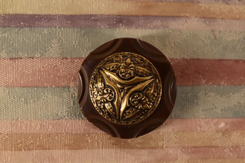 Carved Chocolate Bakelite & Brass Escutcheon Button (1 of 2)