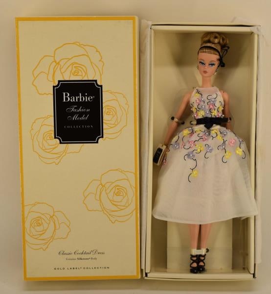 2015 Barbie Cocktail Dress Fashion Model Doll: Featuring The 2015 Barbie Classic Cocktail Dress Fashion Model Doll, With A Silkstone Body, Gold Label Collection, In Original Box With Tags.