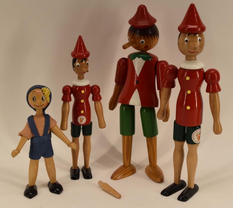 Four Wood Pinocchio Dolls: Featuring Four Painted Wood Pinocchio Dolls, Marked Italy And Sevi 1831 And One Unmarked. Measuring Between 7" To 12", One Has A Replaceable Nose.