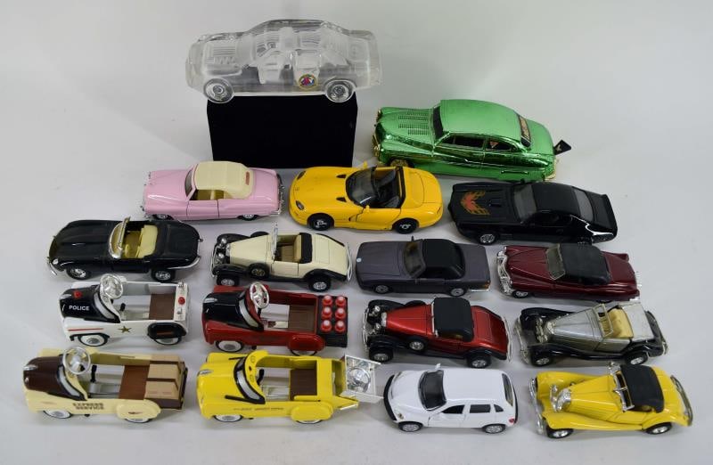 Group Of Toy Cars: Featuring Sixteen Small Toy Cars And Pedal Cars, Measuring Between 3" To 6" Long In Various Colors And Body Styles. Together With A Glass Display Car And A Green Pull Friction Car (working). All In Us