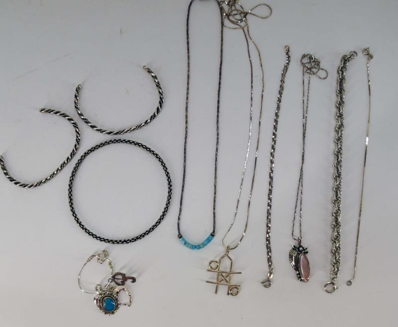 Sterling Silver Necklaces And Bracelets: Featuring A Group Of Sterling Silver Necklaces And Bracelets. Two Sterling Silver Necklaces With Sterling Silver Pendants And A Sterling Silver Charm Pendant With Four Charms. Three Sterling Silver Ch