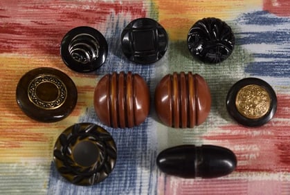 Nine Early Plastic Buttons