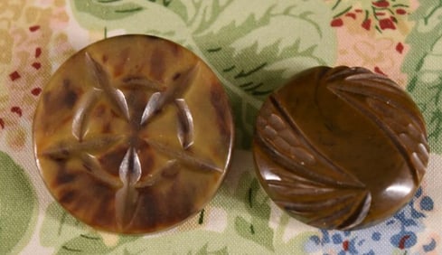 Two Carved Bakelite Buttons