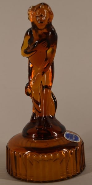 Imperial Glass Bashful Charlotte Figure: Featuring The Imperial Glass Bashful Charlotte Or Venus Rising Figure. Measuring 6 1/2" Tall In Amber, With The Original Foil Label. Good Condition.