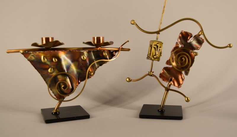 Jewish Dreidel Metal Sculpture: Featuring A Mixed Metal Jewish Dreidel Sculpture. Together With A Mixed Metal Shabbat Candle Holder. Both Pieces Are Unsigned Measuring Between 6" To 10" Tall And 8" To 9" Across. Both Are In Good Con