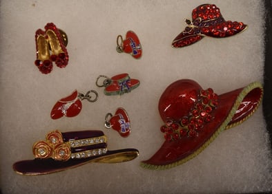 Group Of Red Hat Charms And Pins