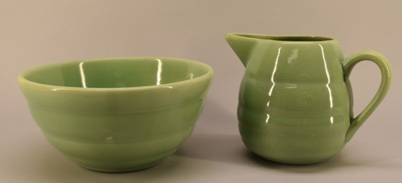 Bauer Pottery Ring ware Pitcher & Mixing Bowl: Featuring A Green Bauer Pottery Pitcher And Mixing Bowl In A Ring ware Pattern. The Pitcher Measures 6 1/4" Tall And 8 1/2" Spout To Handle. The Bowl Measures 4 3/4" Tall And 9 1/2" Across. Both Piece