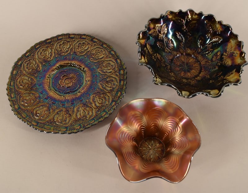 Three Fenton Amethyst Carnival Glass Articles: Featuring A Vintage Fenton Peacock Tail Featuring Ruffled Bowl, A Persian Medalion Tray And A Holly Bowl. The Peacock Tail Measures 3" Tall And 6" Across. Persian Medalion Measures 1" Tall And 9" Acro