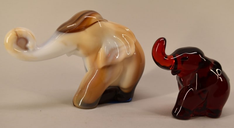 Mosser And Imperial Glass Elephants: Featuring The Imperial Slag Glass Elephant And The Mosser Red Glass Elephant. Both In Good Condition Measuring Between 3 1/2" To 4" Tall And 4" To 6" Long.