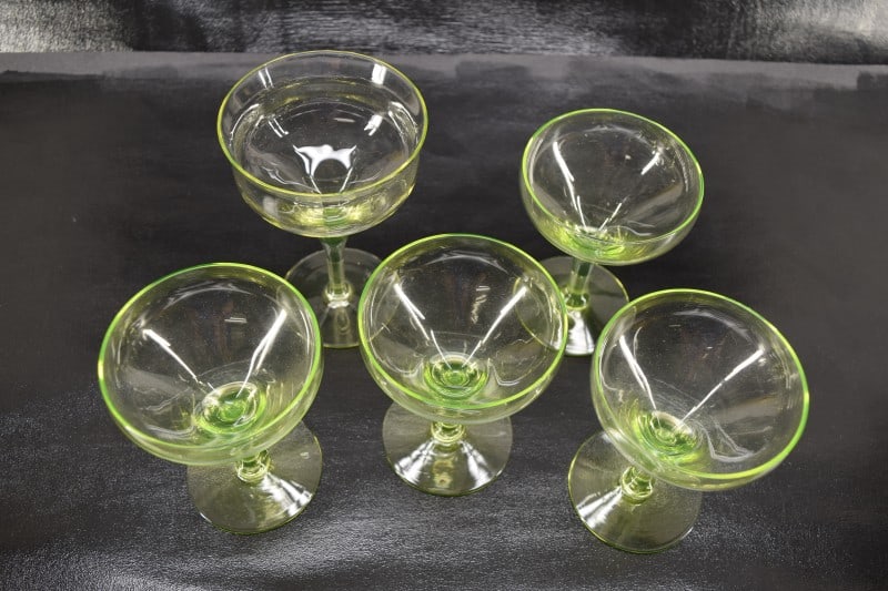Five Vaseline Uranium Glass Stemware: Featuring Five Various Vaseline Or Uranium Glass Stemware. Champagne Glasses And Wine Glass. Good Condition, No Nicks Or Chips.