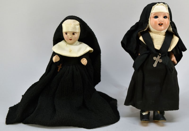 Antique Catholic Nun Bisque & Composition Dolls: Featuring A Princess Ann Bisque Doll, Measuring 8" Long, Marked Princess Ann On The Back Of The Doll. Together With A Porcelain And Composition Nun Doll, Measuring 8" Long. Unmarked With Sleepy Eyes A