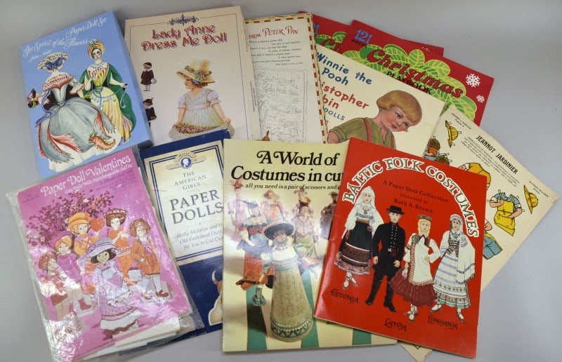Collection Of Vintage Paper Dolls And Decorations: Featuring Paper Dolls From The 1990's Including Costumes, Valentines, Etc. Most Are Uncut And In Very Good Condition.