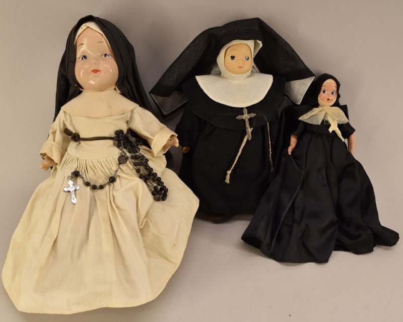 Antique Catholic Nun Bisque & Composition Dolls: Featuring A Nancy Ann Bisque Doll, Measuring 8" Long, Unknown If Marked, Habit Sewn Together. Together With A Porcelain Face With A Cloth Body And Rubber Hands, 9" Long. A Composition 12" Nun In A Whi