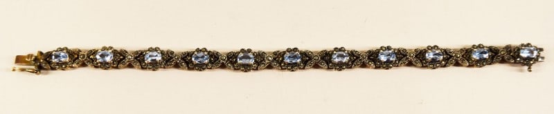 Sterling Silver Marcasite & Blue Topaz Bracelet: Featuring A Sterling Silver Marcasite & Blue Topaz Bracelet, Marked 925. Measuring 7" Long And 1/4" Wide, In Excellent Condition.