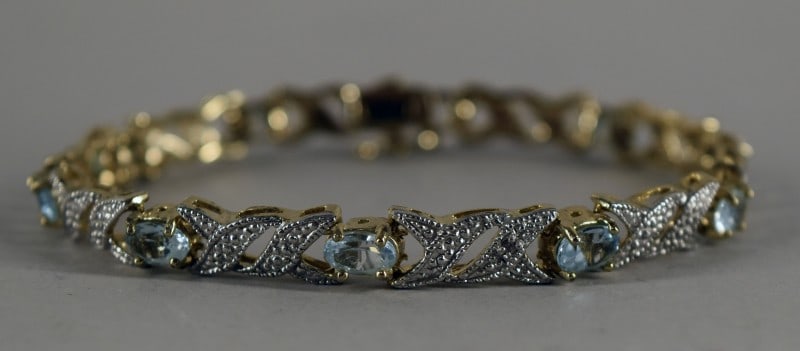 Sterling Silver Blue Topaz Bracelet: Featuring A Sterling Silver Vermeil Bracelet With Blue Topaz. Measuring 7", In Excellent Condition.