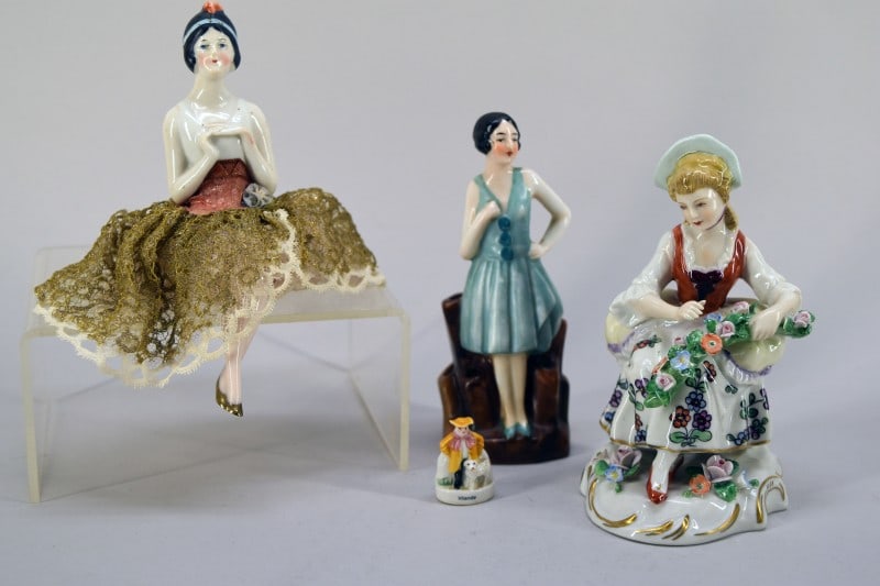 German Sitzendorf Porcelain Maiden Figure: Featuring A Sitzendorf Germany Porcelain Figure Of A Maiden With Flowers, Measuring 5" Tall And 3" Across, Good Condition. Together With Two Art Deco Porcelain Figures And A Tiny Staffordshire Ireland