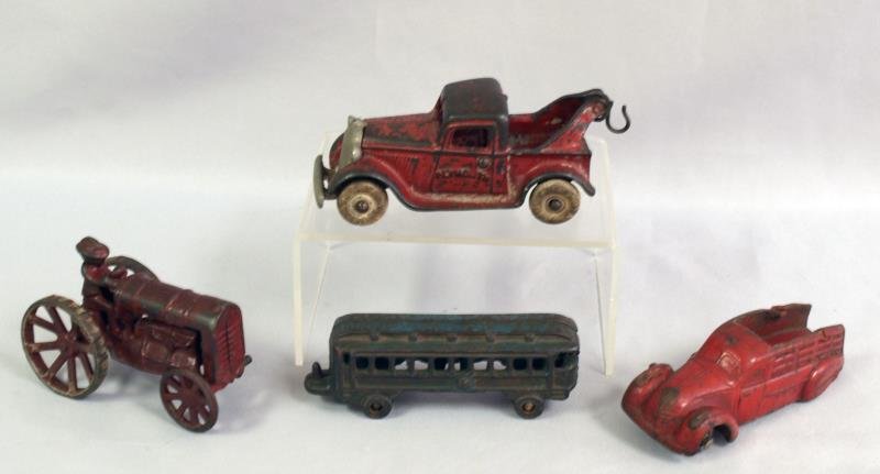 1940's Arcade Tractor and Plymouth tow truck: Tractor and tow truck are cast iron along with train car of cast iron, The little red car is all rubber, some missing parts on all