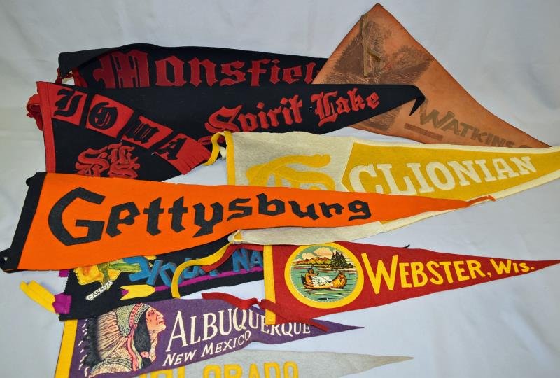 Group of Vintage Souvenir Pennants: Consisting of nine pennants from Albuquerque, Iowa, Colorado, Webster, Sioux Narrows Canada, a leather pennant from Watkins Glen New York and more.