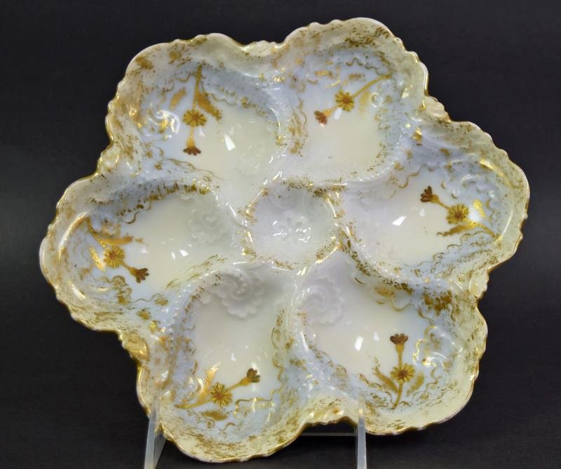 Limoges Oyster Plate: Hallmarked Limoges France, V. F., 9.5" across. Wear to the guild, no nicks or cracks.