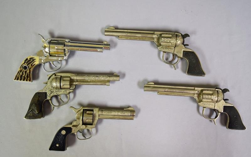 Pair of Roy Rogers Cap Guns: Together with a Smokey Joe cap gun, Nichols Stallion toy gun and a Matel Shootin' Shell Fanner gun.