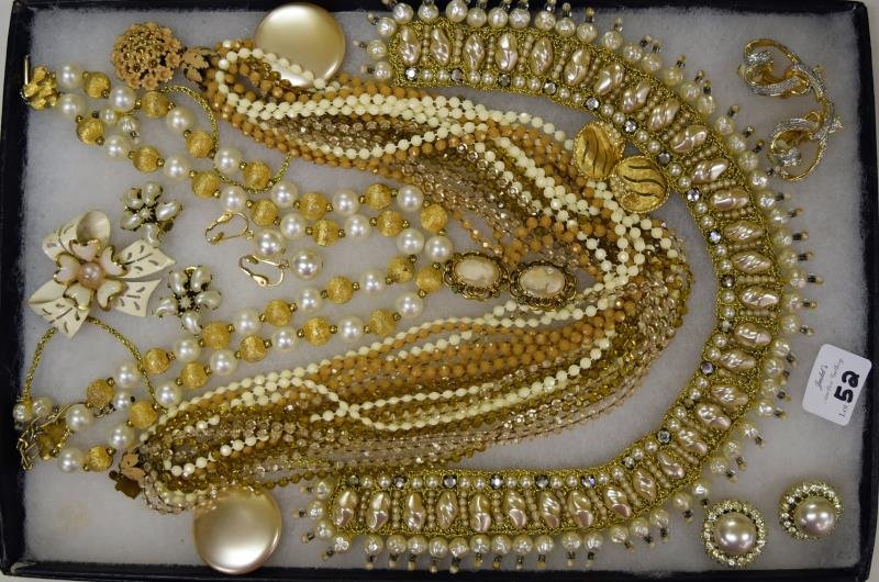 Collection of Faux Pearl Costume Jewelry: Consisting of faux pearl and rhinestone Coro earrings, faux pearl collar, brushed god double strand necklace. BSK earrings and other pieces of costume jewelry.