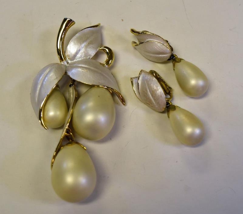 Park Lane Demi-Parure Set: Consisting of a brooch or pendant leaf form with tear drop pearlized drops and a pair of matching earrings. The pin measures 3.25" long and almost 2" wide, the earrings are 1.5" long and .5" wide.
